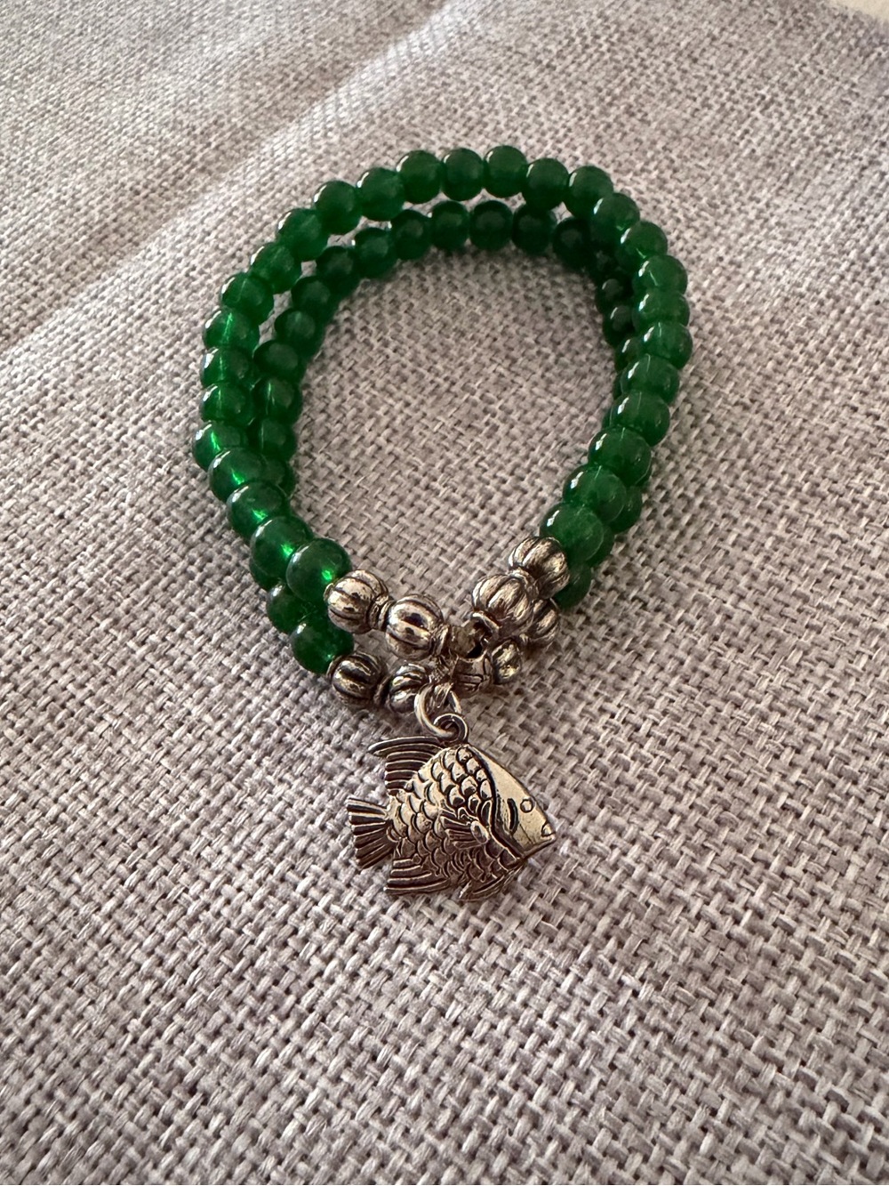 Green Beaded Bracelet with Silver Fish Charm